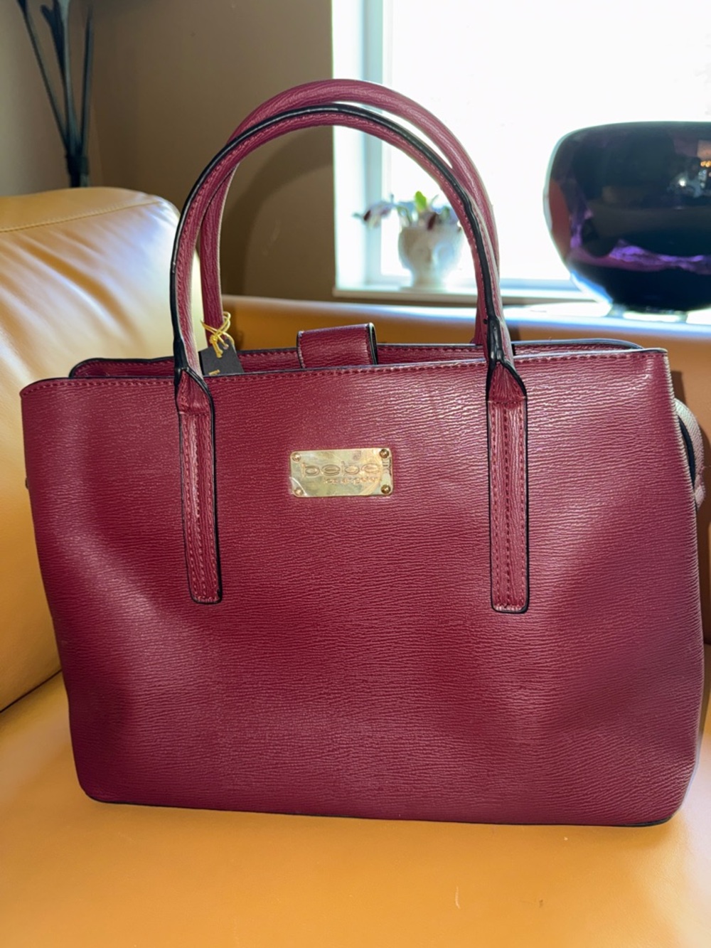 bebe Aubrey Satchel Tote in Wine with Gold Hardware